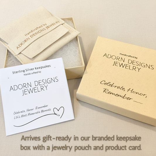 Branded Adorn Designs keepsake box, jewelry pouch, and product description card on soft neutral background.