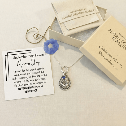September morning glory birth flower sterling silver necklace with sapphire-blue CZ stone, Adorn Designs gift box, pouch, and September morning glory meaning card.