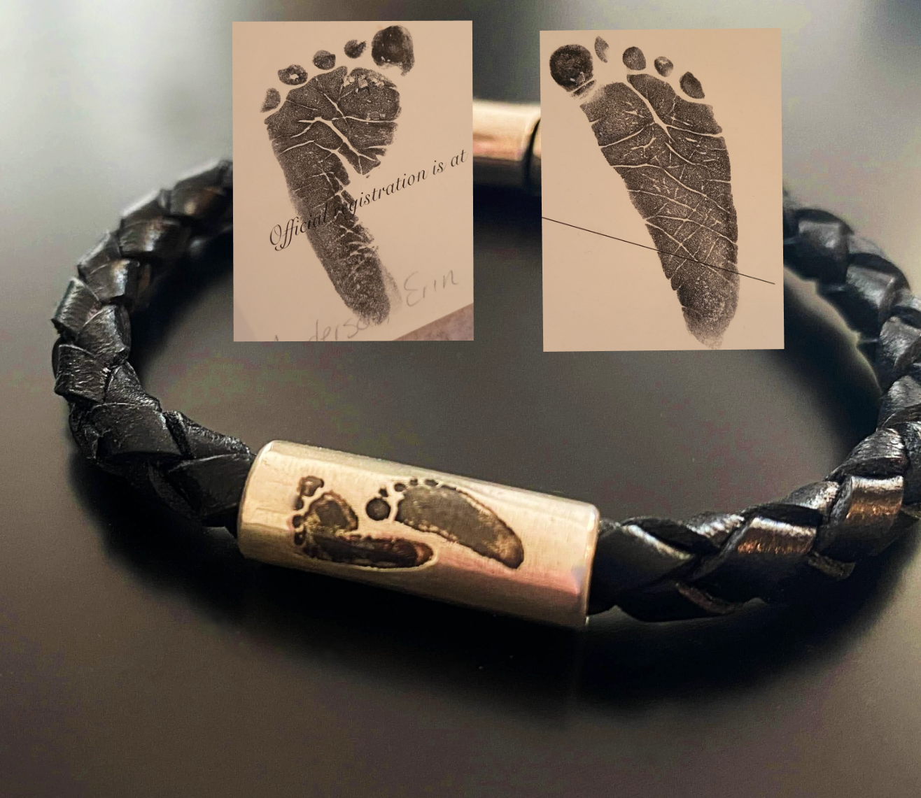 babies footprint reproduced on sterling silver tube bead on leather bracelet