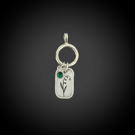 Sterling-silver May Lily of the Valley birth-flower charm with 4 mm Emerald CZ and hinged charm holder.