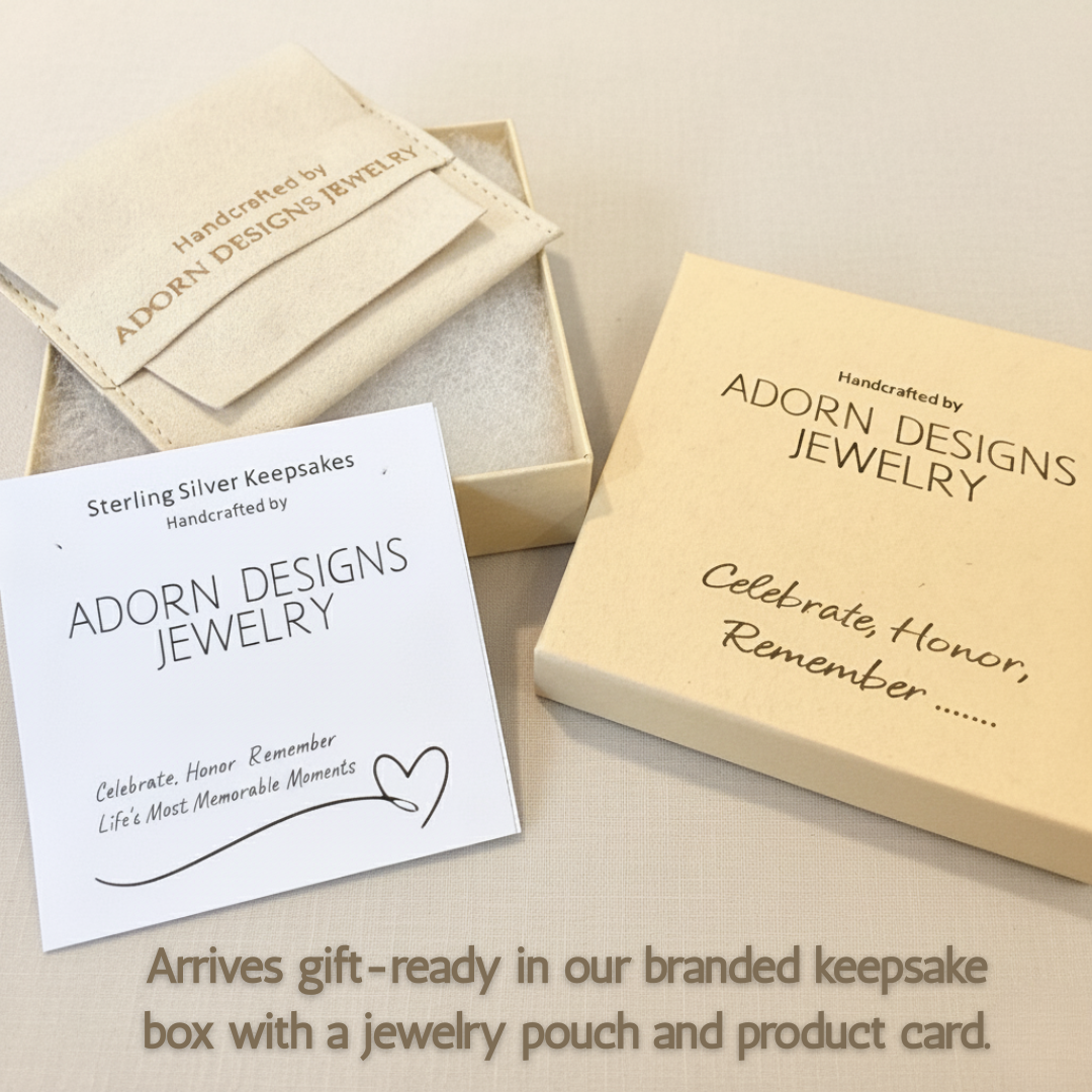Branded Adorn Designs keepsake box, jewelry pouch, and product description card on soft neutral background.