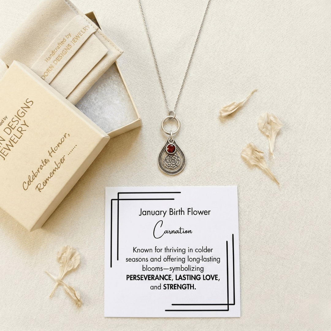 January carnation birth flower sterling silver necklace with garnet-red CZ birthstone, Adorn Designs gift box, pouch, and January carnation meaning card.