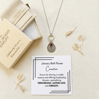 January carnation birth flower sterling silver necklace with garnet-red CZ birthstone, Adorn Designs gift box, pouch, and January carnation meaning card.