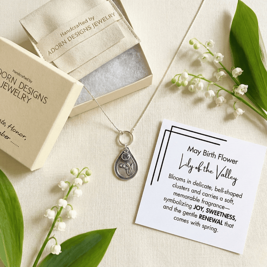 May lily of the valley birth flower sterling silver necklace with alexandrite CZ stone, Adorn Designs gift box, pouch, and May lily of the valley meaning card.