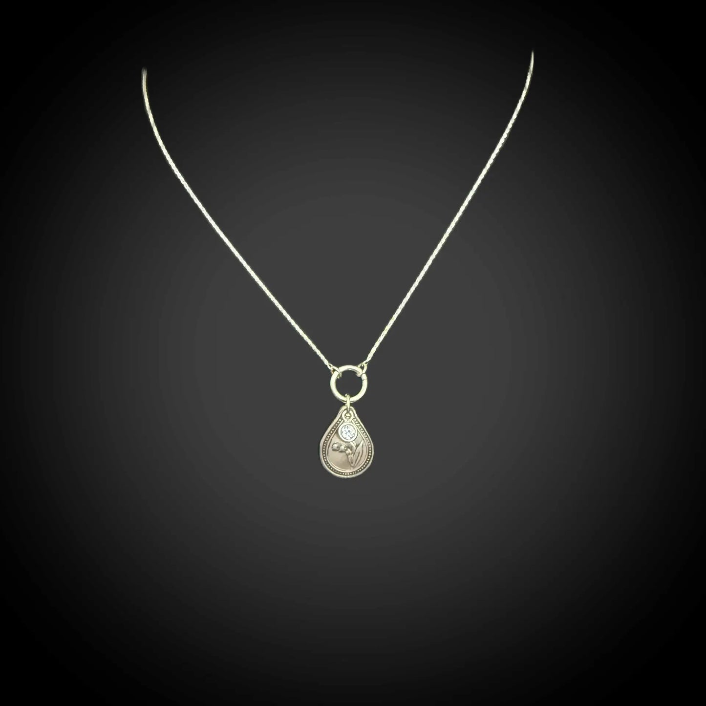 Sterling silver May birth flower necklace with lily of the valley engraving and alexandrite CZ stone by Adorn Designs Jewelry.