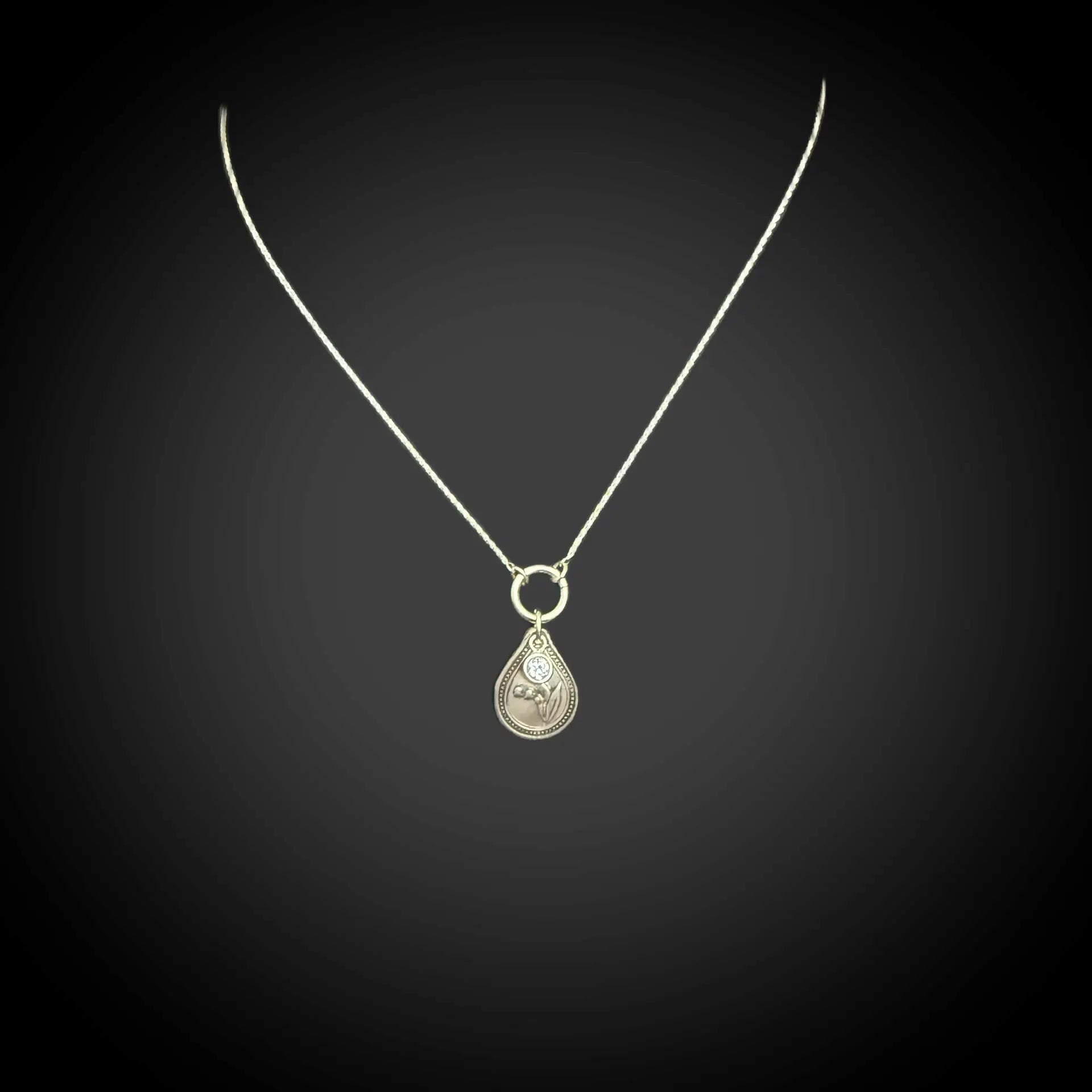 Sterling silver May birth flower necklace with lily of the valley engraving and alexandrite CZ stone by Adorn Designs Jewelry.