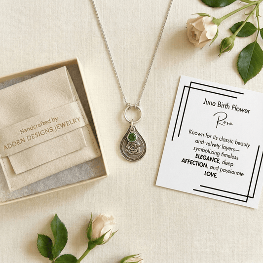 June rose birth flower sterling silver necklace with emerald-green CZ stone, Adorn Designs gift box, pouch, and June rose meaning card.