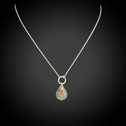Sterling silver January birth flower necklace with carnation engraving and garnet-red CZ birthstone by Adorn Designs Jewelry.