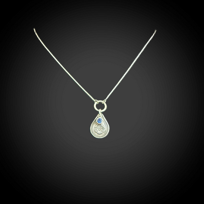 Sterling silver September birth flower necklace with morning glory engraving and sapphire-blue CZ stone by Adorn Designs Jewelry.