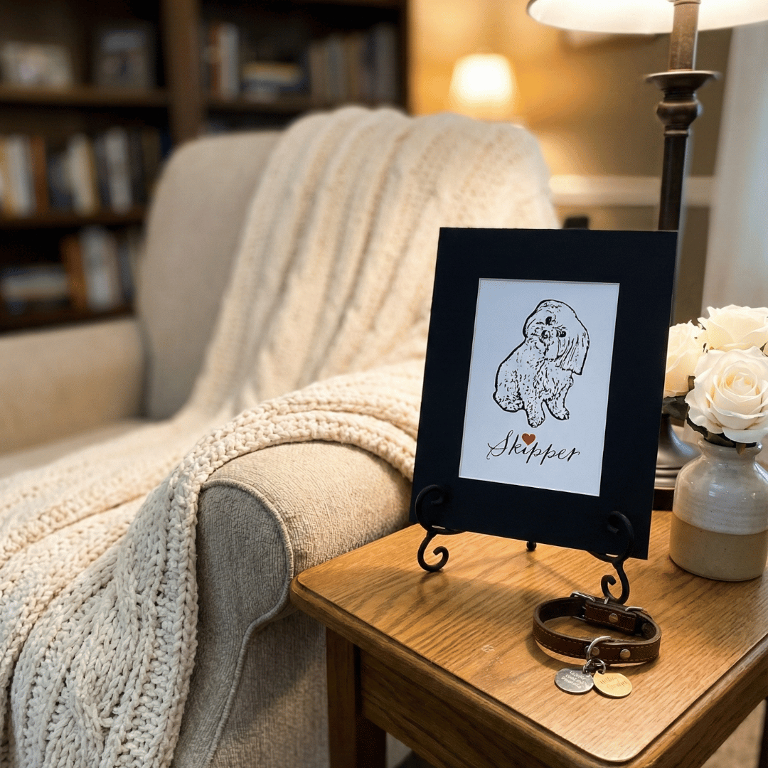 pet memorial  art print and mat sitting on a table next to a chair