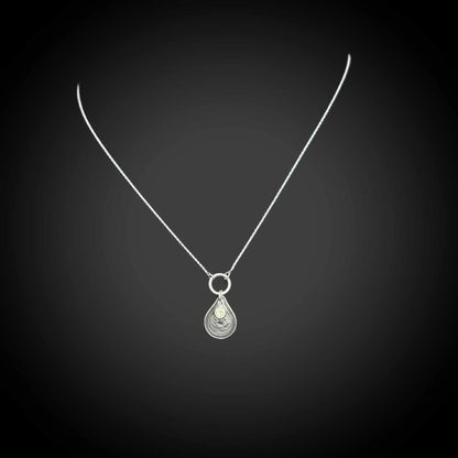 Sterling silver August birth flower necklace with poppy engraving and peridot-green CZ stone by Adorn Designs Jewelry.