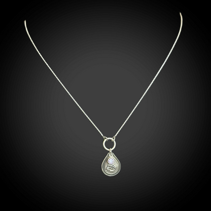 Sterling silver February birth flower necklace with violet engraving and amethyst-purple CZ stone by Adorn Designs Jewelry.