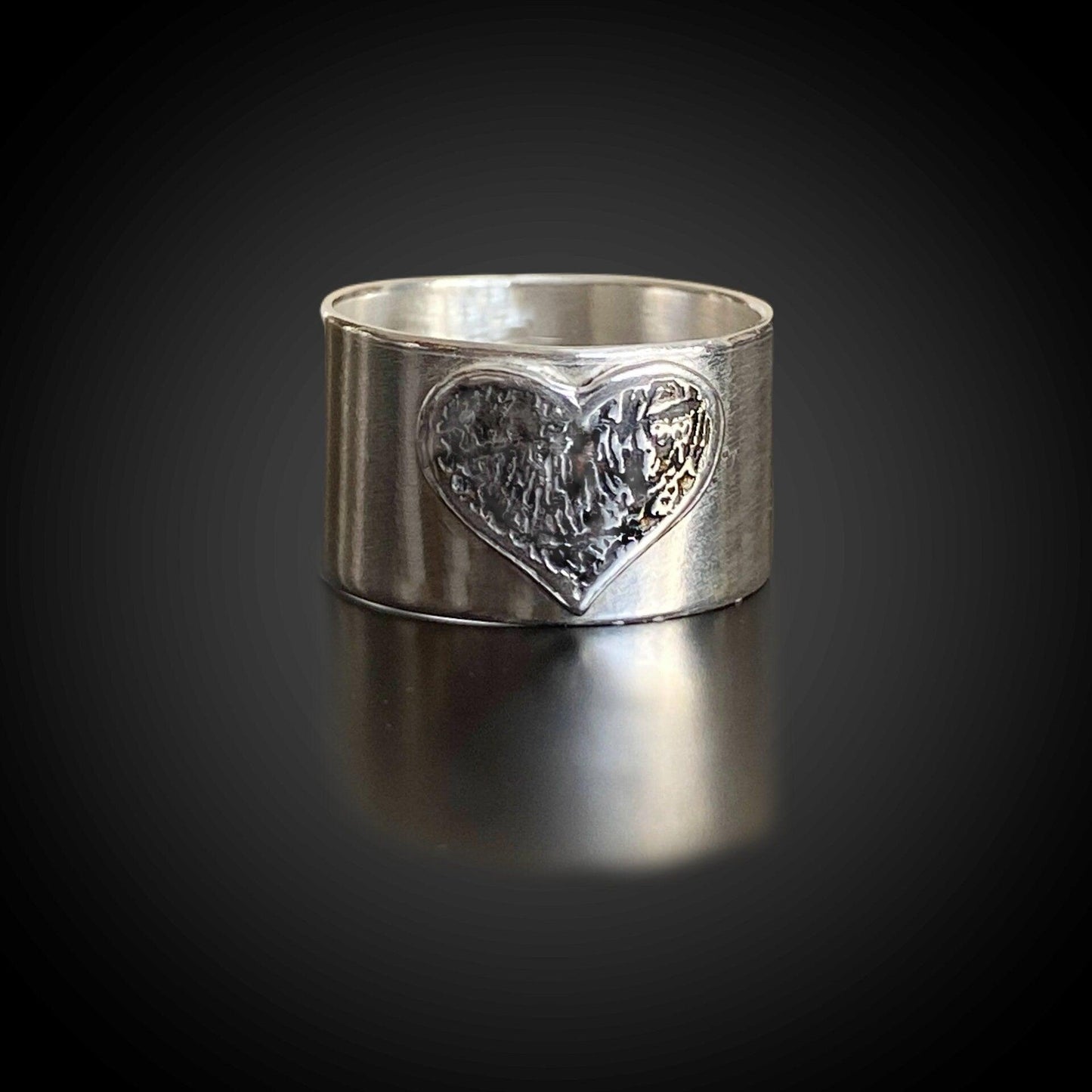 Wide-band sterling-silver fingerprint heart ring with recessed inlay—modern memorial design