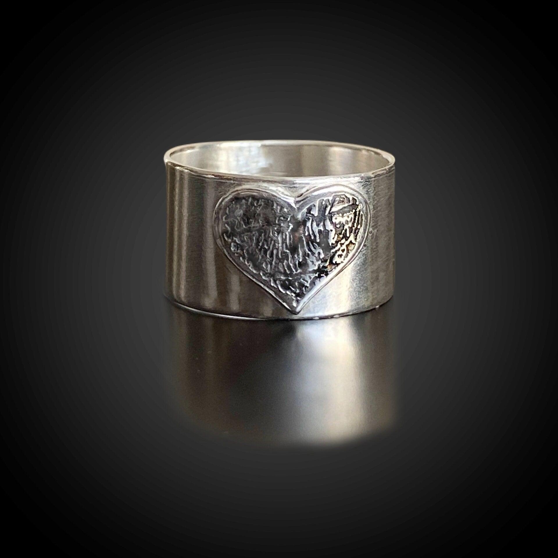 Wide-band sterling-silver fingerprint heart ring with recessed inlay—modern memorial design